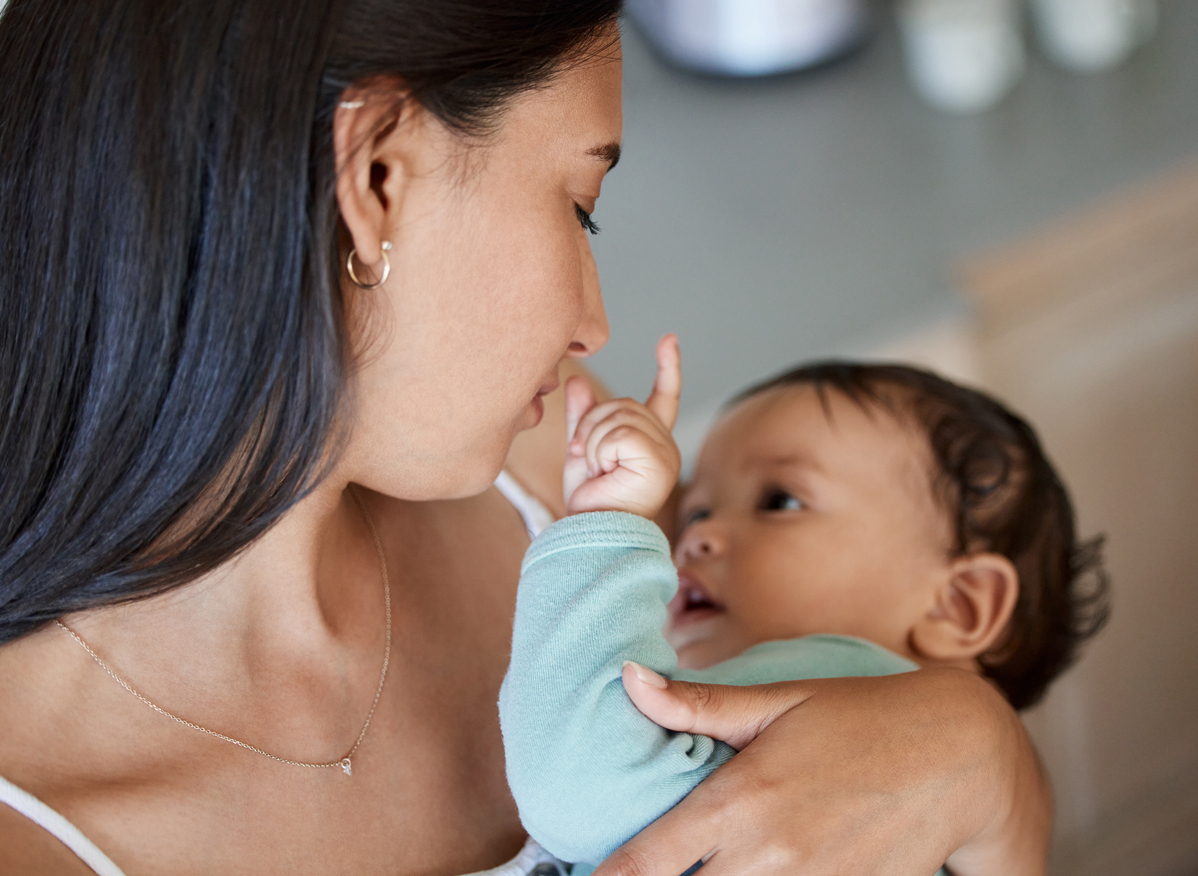 Shot of a young mother bonding with her baby at home